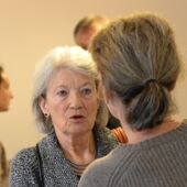 Close-up of Renate Lachmann talking to a woman