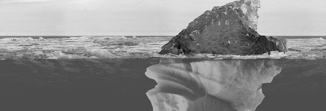 Stylized black and white image of an iceberg half rising out of the water, half underwater.