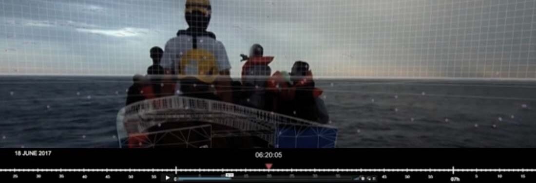 Still from "The Seizure of the Iuventa". A boat in the sea. Various people stand on the boat wearing life jackets. At the bottom left of the image a date: 18 June 2017. At the bottom of the image a timeline with the marker 06:20:05.