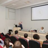 Wide shot of the hall with the audience, Sigrid Weigel and Giga Zedania during its introduction