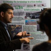 Standing in front of a poster titled “Questioning the terminology in urban studies,” Hassan El Mouelhi explains.