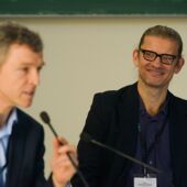 Dirk Naguschewski listens to a lecture and smiles