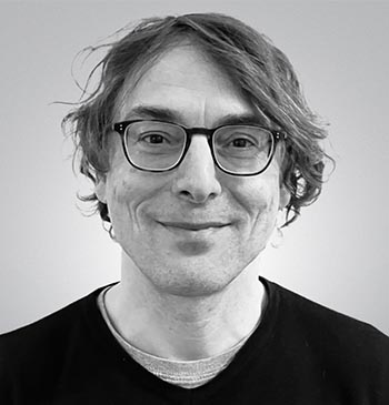 Black and white portrait photo of Falko Schmieder